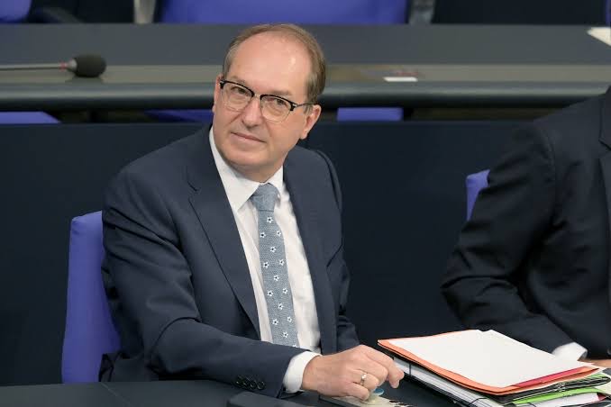 Alexander Dobrindt seated in the Bundestag plenary chamber
