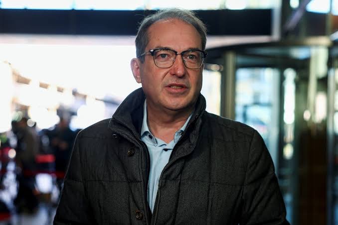 Alexander Dobrindt in a dark jacket speaking to reporters